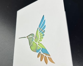 Hummingbird cut out handmade card. Suminagashi Marbling background