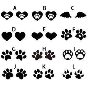 May include: A set of 12 black and white paw print and heart designs. The designs are labeled with letters A through L. The designs are perfect for crafting, scrapbooking, or other creative projects.