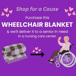May include: Purple graphic with text "Shop for a Cause" and "Wheelchair Blanket." A rolled blanket with a brown and gray checkered pattern is shown, along with an illustration of a person in a wheelchair. The text says the blanket will be delivered to a senior in need.