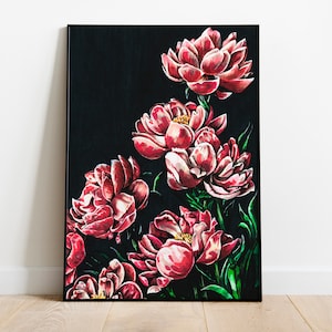 May include: A framed painting of pink peonies on a black background. The peonies are arranged in a cluster, with some of the flowers overlapping. The painting is framed in a black frame.