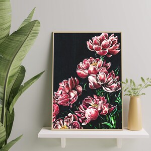 May include: A framed print of a floral painting featuring pink peonies on a black background.
