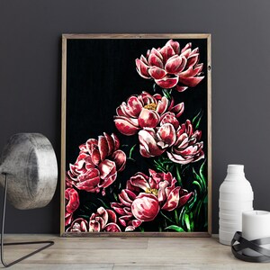 May include: A framed painting of red peonies on a black background. The peonies are arranged in a cluster, with some flowers facing the viewer and others facing away. The painting is framed in a simple wooden frame.