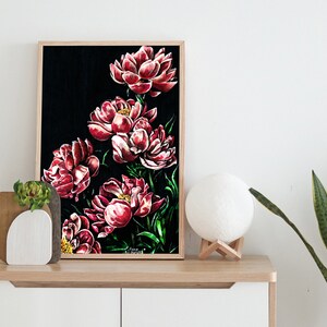 May include: Framed painting of red peonies on a black background. The painting is in a wooden frame and is hanging on a white wall.