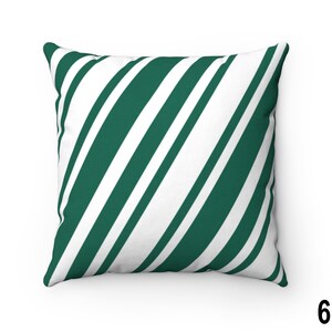 May include: A green and white striped throw pillow with a diagonal pattern.