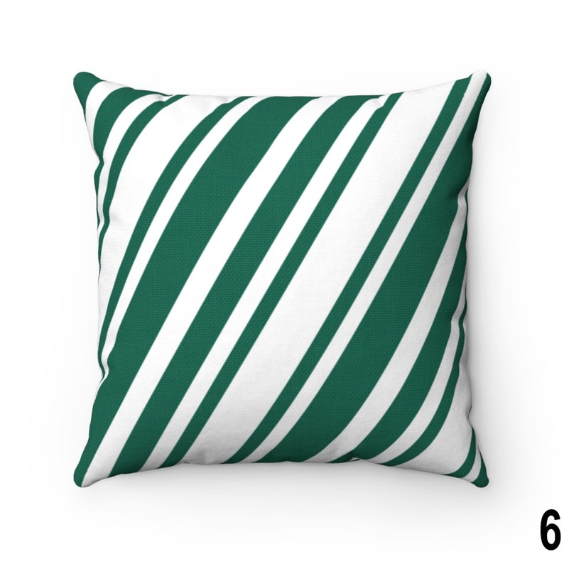 May include: A green and white striped throw pillow with a diagonal pattern.