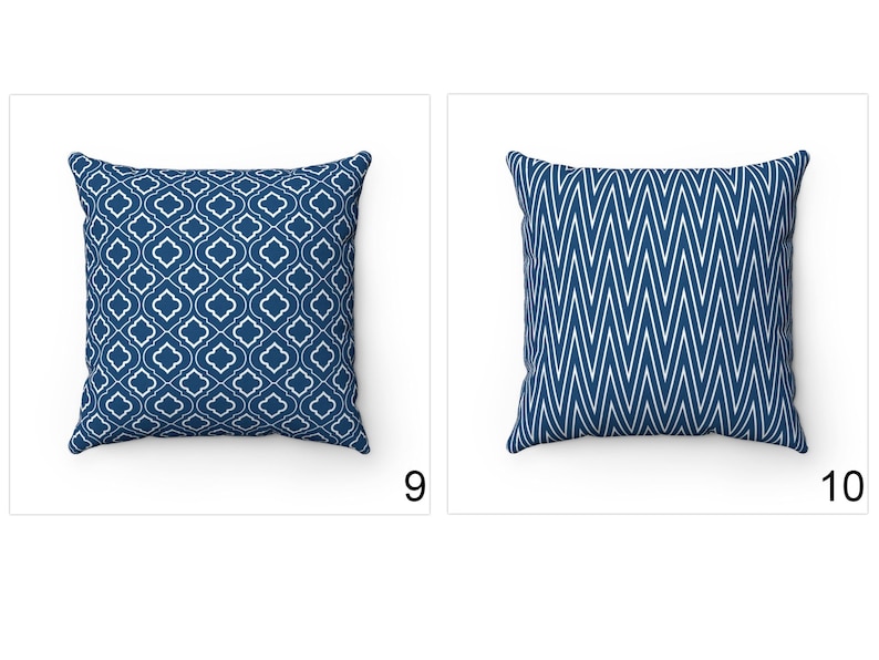 May include: Two blue throw pillows with white geometric patterns. The pillow on the left has a repeating quatrefoil design. The pillow on the right has a chevron pattern.