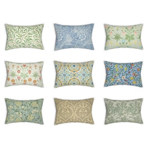 May include: Nine decorative throw pillows with various floral and geometric patterns in shades of green, blue, yellow, and orange. The pillows are arranged in three rows of three.