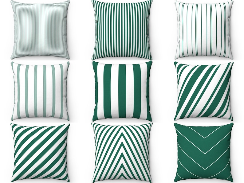 May include: Nine decorative throw pillows with different green and white striped patterns. The pillows are arranged in three rows of three.