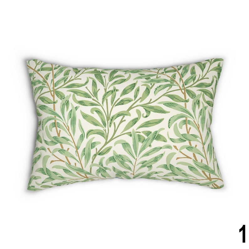 May include: A rectangular throw pillow with a white background and a green leaf pattern. The pillow is made of a soft, comfortable fabric and is perfect for adding a touch of nature to your home decor.