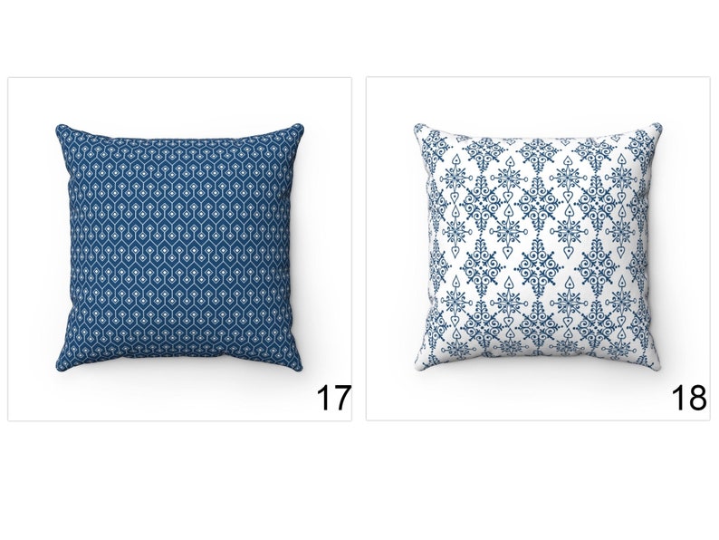 May include: Two decorative throw pillows with blue and white geometric patterns. The pillow on the left has a repeating pattern of small white hexagons on a dark blue background. The pillow on the right has a larger, more intricate pattern of white shapes on a white background.