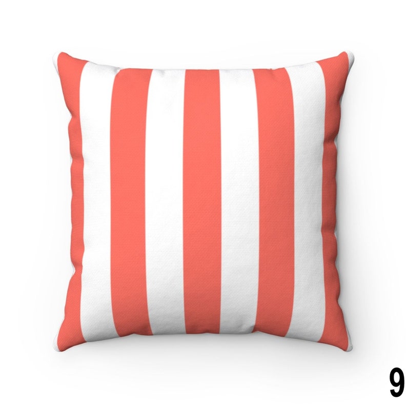 May include: A coral and white striped throw pillow. The pillow is made of a soft, comfortable fabric and has a square shape.
