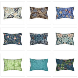 May include: Nine rectangular throw pillows with various floral and botanical patterns. The pillows feature designs in shades of blue, green, brown, and orange. Some pillows have detailed leaf and flower motifs, while others have geometric or stylized patterns.