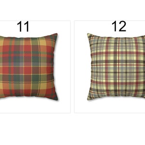 May include: Two square throw pillows with plaid patterns. One pillow features a red, green, and gold plaid design, labeled "11". The other pillow has a beige, red, and gray plaid pattern, labeled "12".