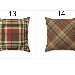 May include: Two square throw pillows with plaid patterns. One pillow features a red, brown, and green plaid design, and the other has a diagonal plaid pattern in red, brown, and tan. The pillows are displayed on a white background.