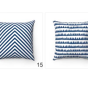 May include: Two decorative throw pillows with geometric patterns. The pillow on the left has a white background with navy blue chevron stripes. The pillow on the right has a white background with navy blue triangle shapes.