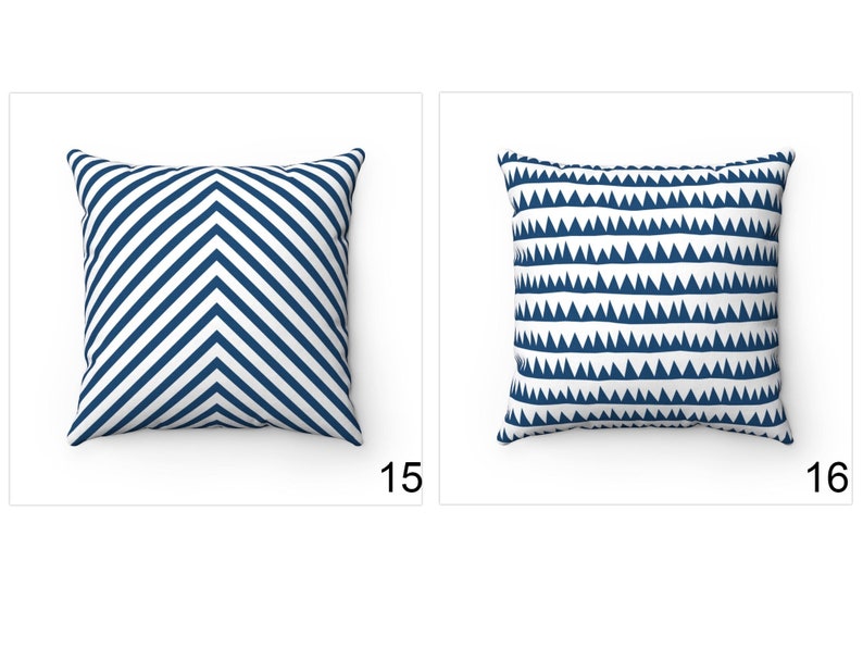 May include: Two decorative throw pillows with geometric patterns. The pillow on the left has a white background with navy blue chevron stripes. The pillow on the right has a white background with navy blue triangle shapes.