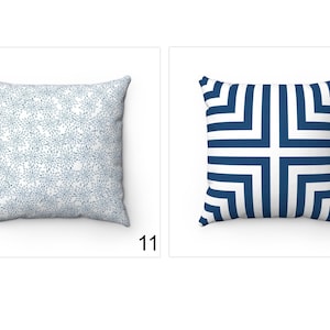 May include: Two decorative throw pillows. The first pillow has a white background with a blue floral pattern. The second pillow has a white background with a blue geometric pattern.