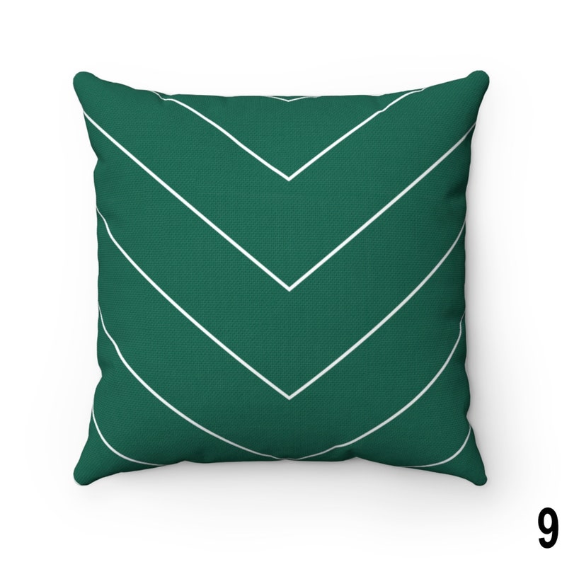 May include: A green throw pillow with a white chevron pattern.