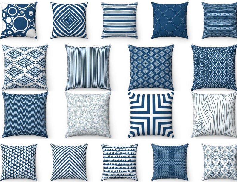 May include: A collection of 16 blue and white throw pillows with various geometric patterns. The pillows are arranged in a grid pattern on a white background.