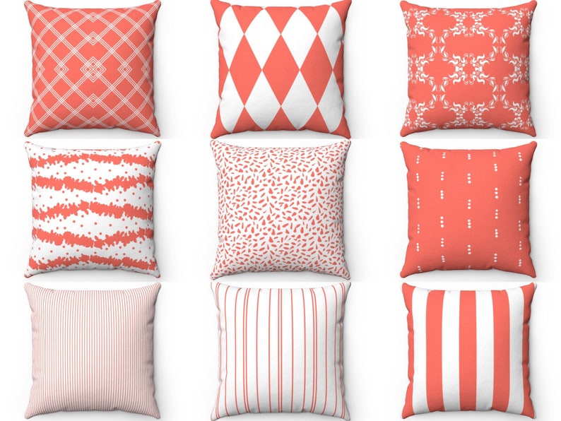 May include: Nine different throw pillow covers featuring various geometric patterns in coral and white. The patterns include stripes, polka dots, diamonds, and floral designs.