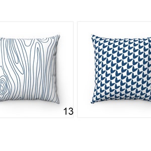 May include: Two decorative throw pillows with different patterns. The pillow on the left has a white background with a blue wood grain pattern. The pillow on the right has a white background with a blue geometric pattern.