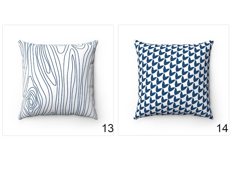 May include: Two decorative throw pillows with different patterns. The pillow on the left has a white background with a blue wood grain pattern. The pillow on the right has a white background with a blue geometric pattern.