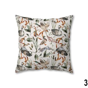 May include: Square throw pillow with a nature-themed pattern. The design features ducks, geese, and a rabbit amidst foliage in shades of green, brown, and beige. The pillow has a white background.