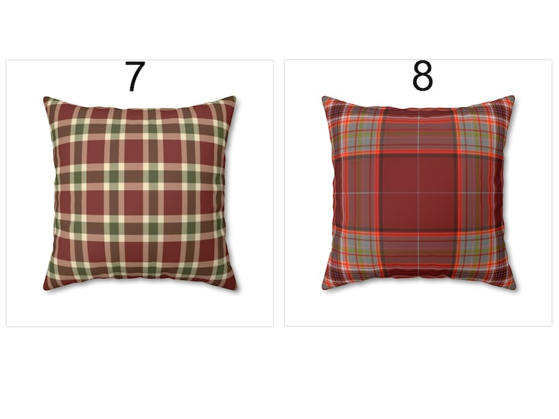 May include: Two square throw pillows with plaid patterns. One pillow features a burgundy, green, and cream plaid design. The other pillow has a burgundy, gray, and orange plaid pattern. Both pillows are displayed on a white background.