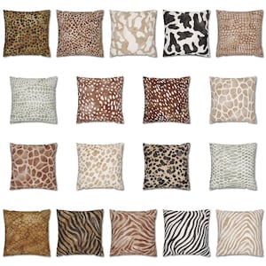 May include: A collection of twenty square throw pillows arranged in a grid, each featuring a distinct animal print pattern including leopard spots, cow hide, giraffe patches, zebra stripes, and various reptilian scale textures in neutral tones.