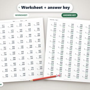 May include: A math worksheet and answer key featuring columns of three-digit addition problems printed in black ink on white paper. A red pencil with a pink eraser lies horizontally across the bottom of the two pages.