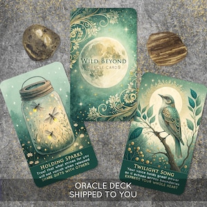 May include: Three rectangular oracle cards with green and gold illustrations. One card shows a full moon with the text Wild Beyond Oracle Cards. Another depicts fireflies in a glass jar with the text Holding Sparks. The third shows a bird with the text Twilight Song.