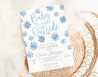 May include: A blue and white baby shower invitation with a snowflake design and the text "Baby it's cold outside". The invitation includes the date, time, location, and RSVP information.