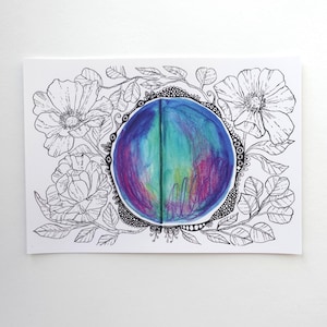 May include: A black and white line drawing of flowers surrounding a colourful, round, abstract watercolour painting.