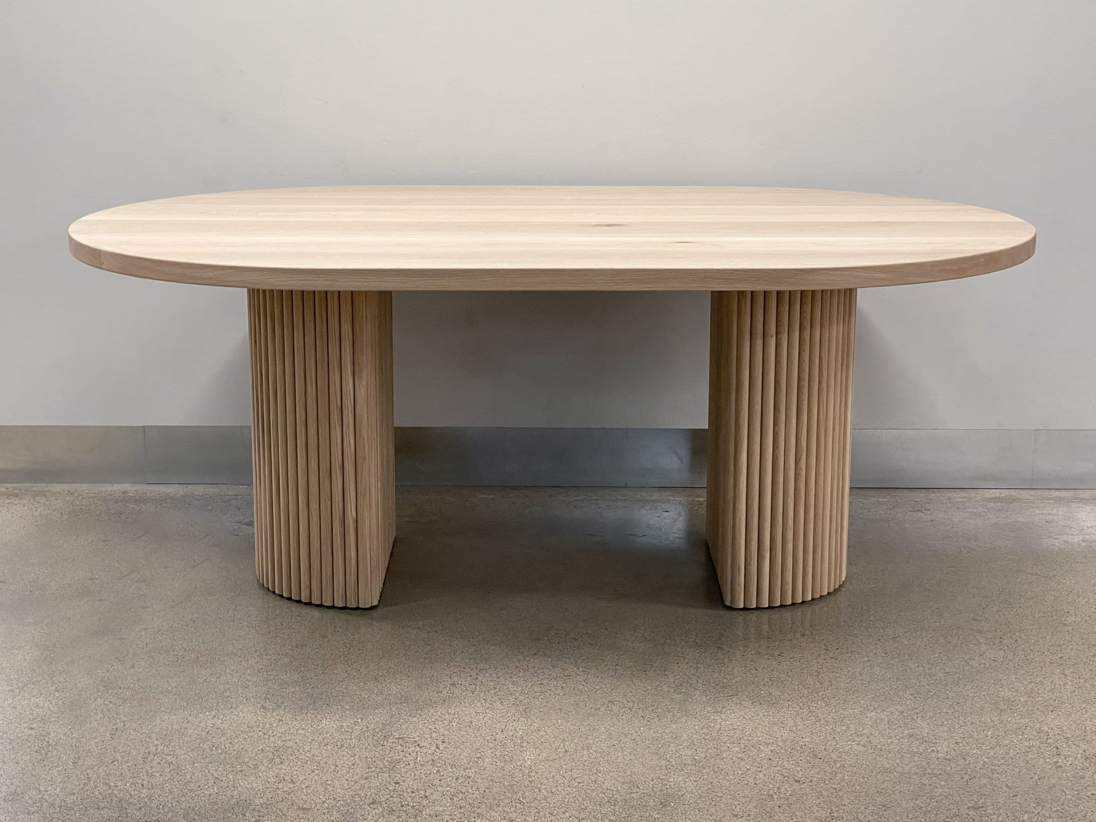 AURA Solid Wood Pill Shaped Dining Table With Fluted tambour Half