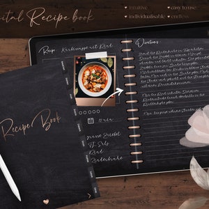 May include: A digital recipe book with the words "digital Recipe book" in a stylish font. The book is open, revealing handwritten recipes and a photo of a dish. A white stylus pen rests on the book. The background is a dark wood.