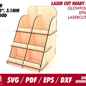 May include: Laser cut ready file for a 3-tiered display stand made of 1/8 inch (3.1 mm) wood. The stand has six rectangular compartments and is designed for use with Glowforge, Epilog, and other laser cutters. SVG, PDF, EPS, and DXF files are included for digital download.