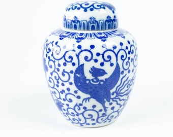 Porcelain lidded vase or tea caddy, Asian motifs, blue and white with dragons, vintage