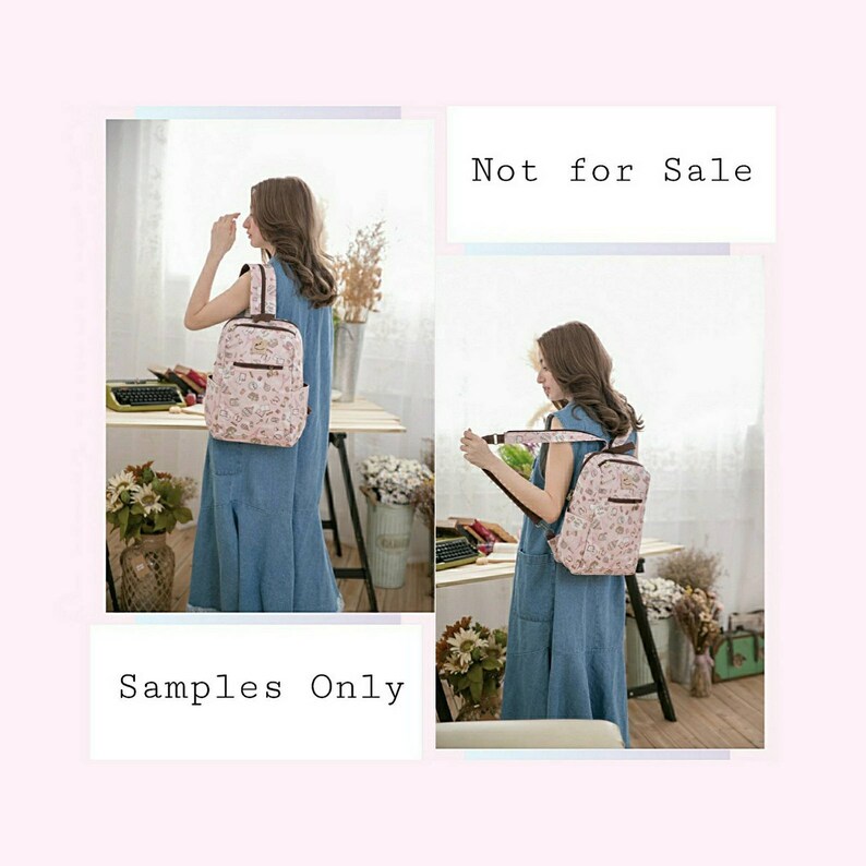May include: A pink floral patterned backpack with brown straps. The backpack is being worn by a person in a blue dress. The text "Not for Sale" and "Samples Only" is visible in the image.