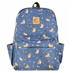 May include: Blue backpack with a pattern of corgis, coffee cups, and donuts. The backpack has a brown leather handle and a zipper closure. The text "I love coffee" is printed on the backpack.