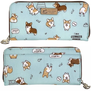 May include: A light blue zippered wallet with a repeating pattern of brown and white corgis. The wallet has a brown leather tag with the text "uma hana" and "TAIPEI TAIWAN". The text "I love corgis" and "uma hana" is printed on the bottom right corner of the wallet.