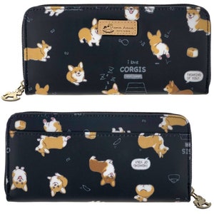 May include: Black zippered wallet with a repeating pattern of cartoon corgis in various poses. The wallet has a gold zipper pull with a small corgi charm. The text "I love corgis" is printed on the front of the wallet.