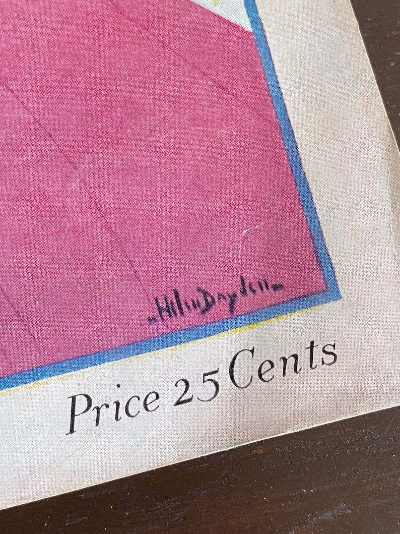 Puede incluir: Una impresi&oacute;n de papel vintage que presenta una gran &aacute;rea magenta bordeada por una fina l&iacute;nea azul. El texto "Price 25 Cents" est&aacute; impreso en una fuente serif negra en la parte inferior. La firma "Helen Dryden" es visible en tinta negra.