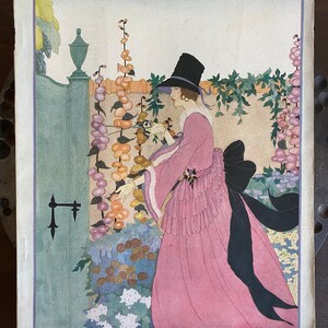 May include: A vintage Vogue magazine cover from March 15, 1918, featuring a woman in a pink dress and black hat standing in a garden. The cover text reads "Spring Fashions Number" and "Price 25 Cents".