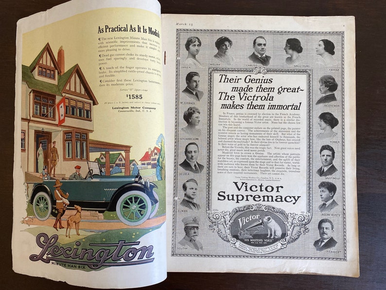 May include: A vintage magazine advertisement for the Victrola, featuring a black and white photo of a gramophone with the text "Their Genius made them great - The Victrola makes them immortal" and "Victor Supremacy".