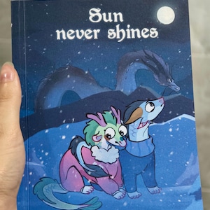 May include: A book cover with the title "Sun never shines" in white text. The cover features an illustration of two fantasy creatures in a snowy landscape with a dragon and a full moon. The author's name and social media handle are at the bottom.