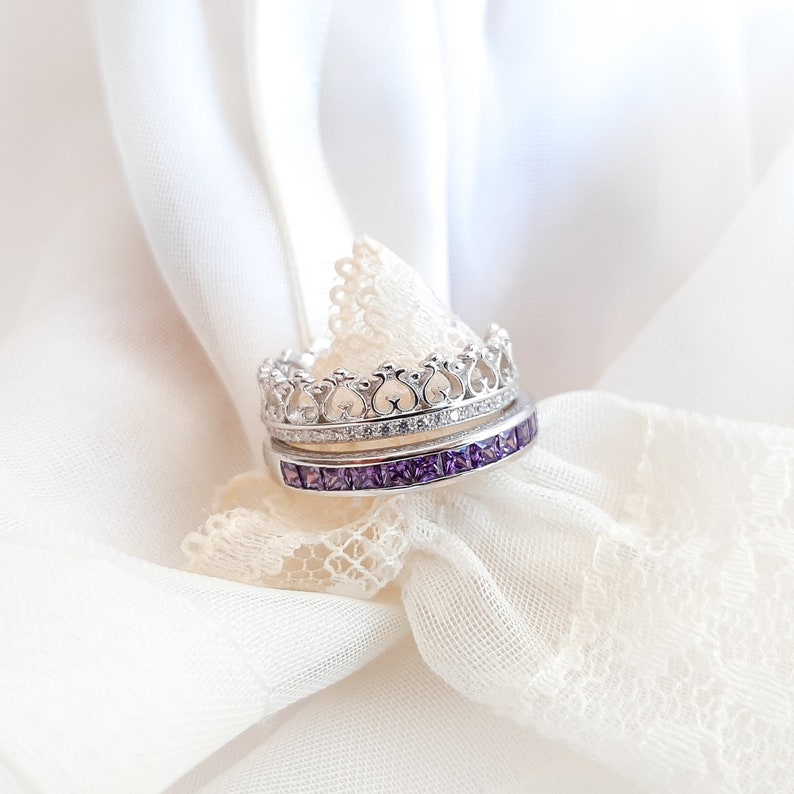 1 carat princess-cut channel set sterling silver ring with brilliant simulated amethyst CZ stones, beautifully packaged in a ribbon-tied gift box. Elegant and versatile band perfect for stacking, wearing alone, or pairing with an engagement ring