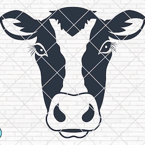 May include: A black and white cow face illustration. The cow's face is a solid black silhouette with white markings on the face. The cow has large eyes, ears, and a prominent nose. The background is a white brick wall.