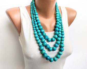 layered beaded crochet necklace with light blue beads