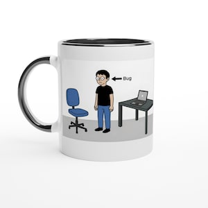 May include: White ceramic mug with a black interior and handle. The mug features a cartoon illustration of a person, a chair, a desk with a laptop, and the word "Bug" with an arrow pointing to the person.
