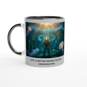 May include: White ceramic mug with a black interior and handle. The mug features an underwater scene with a diver, jellyfish, and the text "LIFE IS BETTER WHEN YOU'RE UNDERWATER" in white.